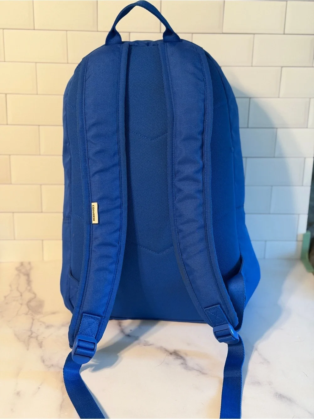 Converse All Star backpack in blue with classic Chuck Taylor logo patch.
